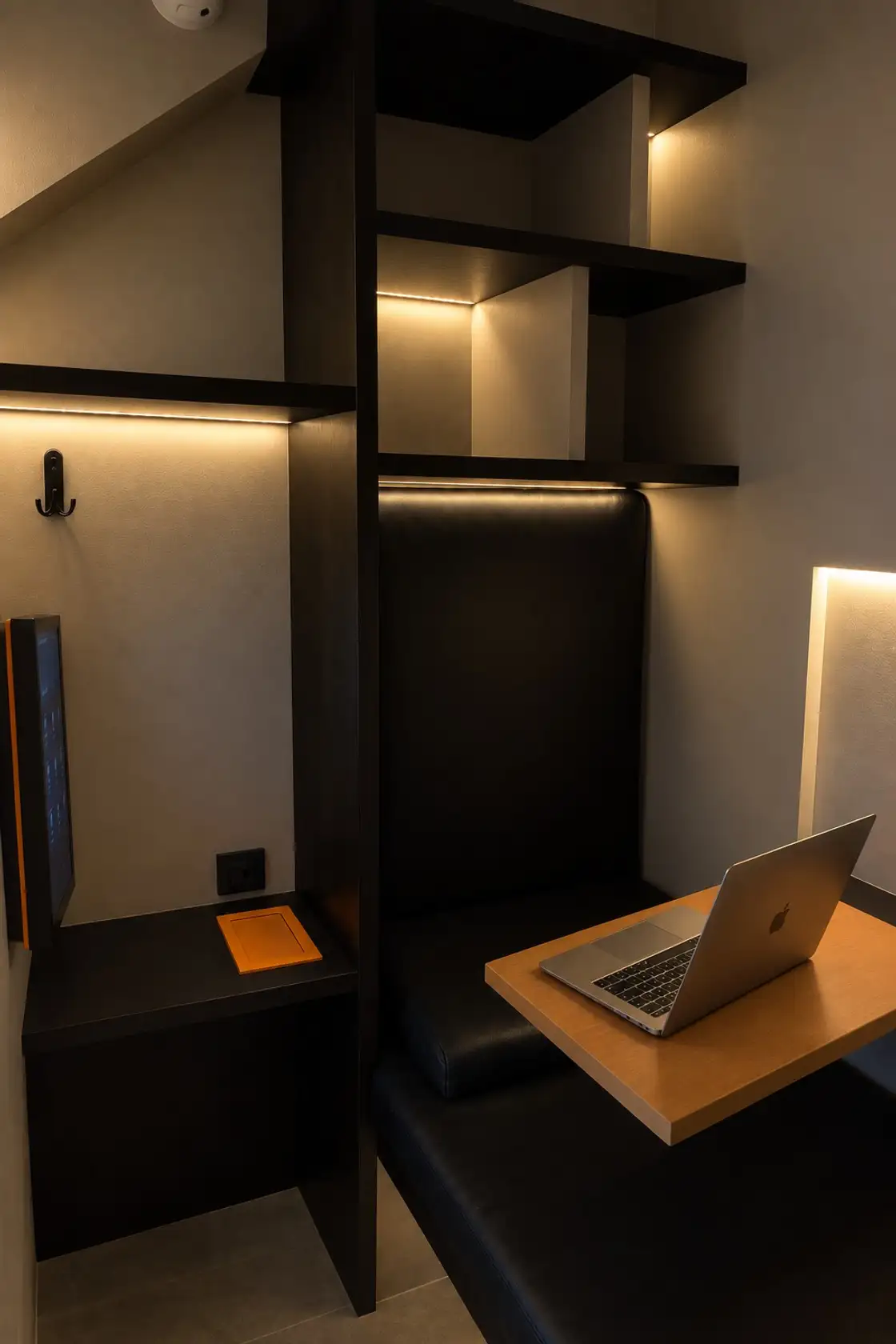 Single room: a bed, a fold-down desk and shelves